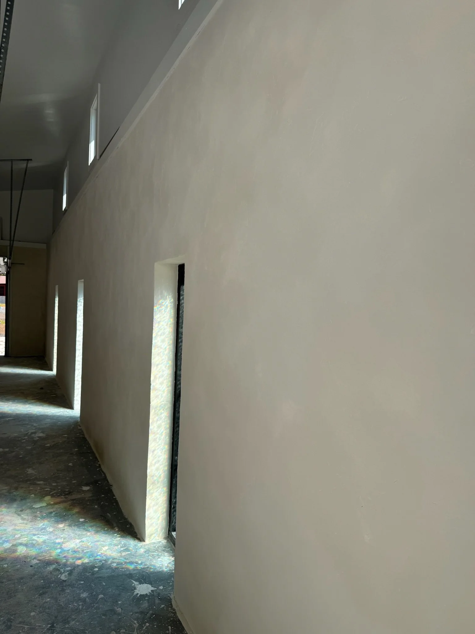 Textured Veneer with Lime Paint, Finished over Brick