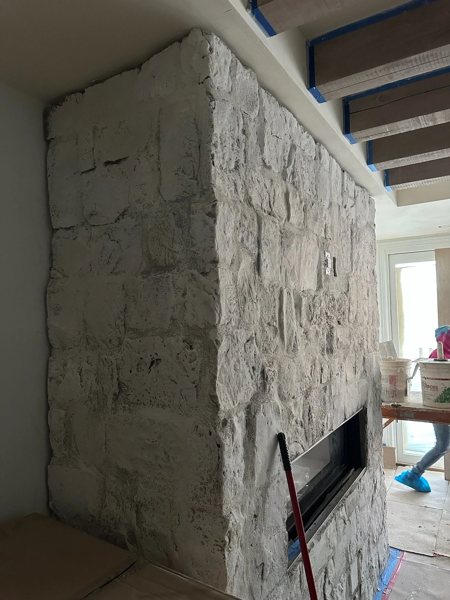 Lime Paint on Top of a Stone Fireplace