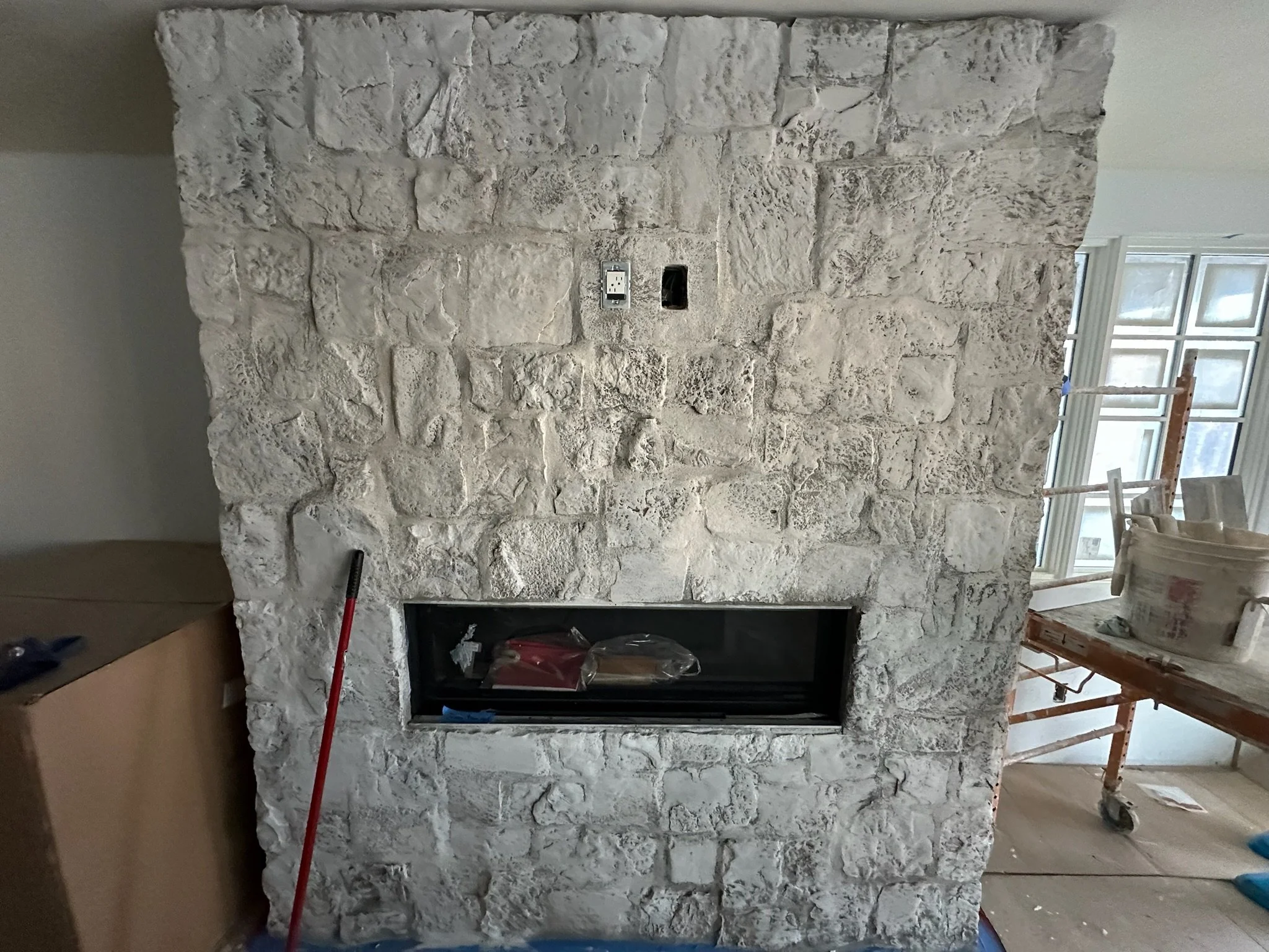 Lime Paint on Top of a Stone Fireplace